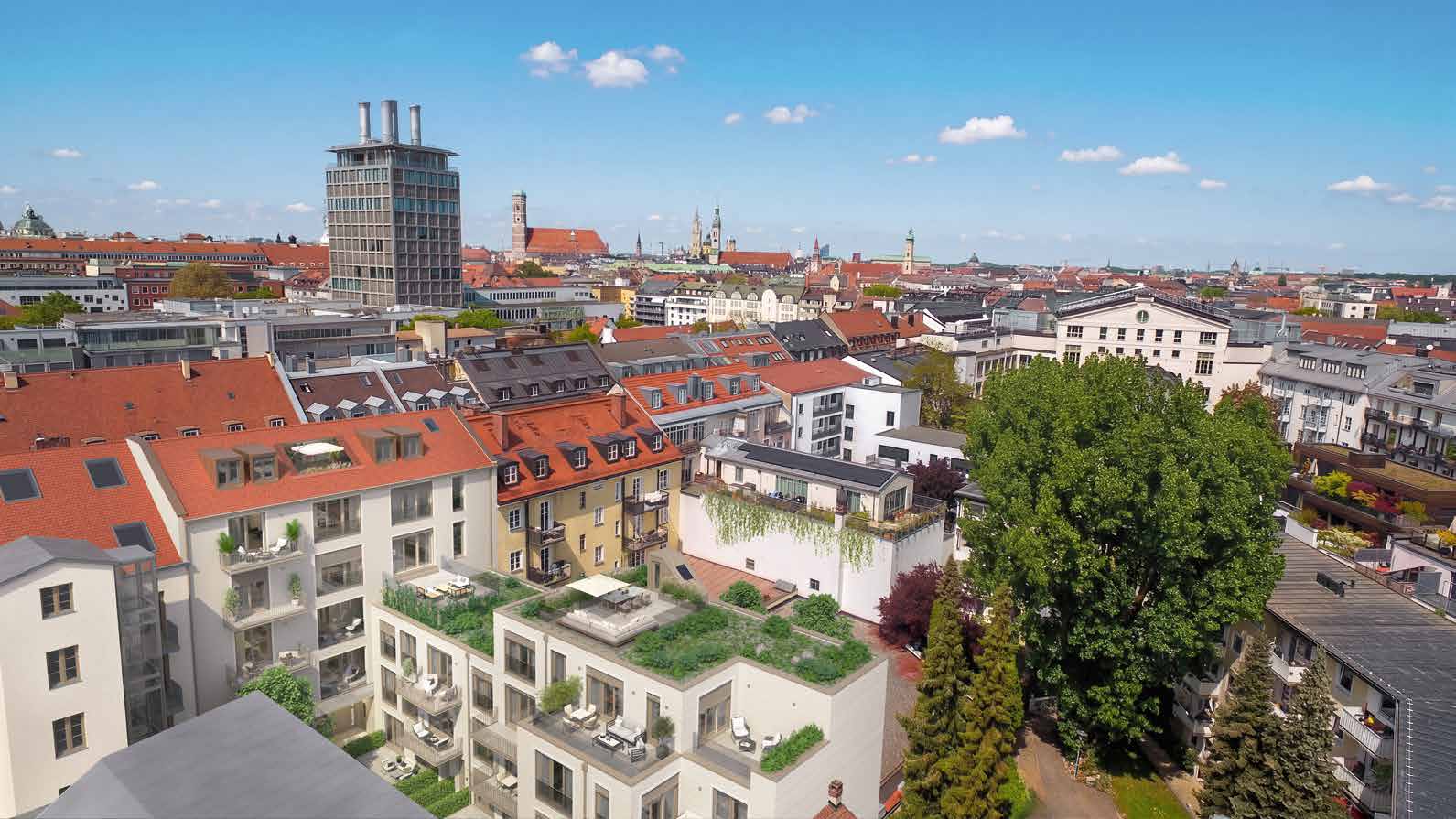 Luftaufnahme des sanierten Vordergebäudes und modernen Rückgebäudes mit Innenhof